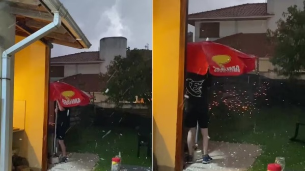 Estaba haciendo un asado, se largó a llover con granizo y siguió cocinando bajo la lluvia