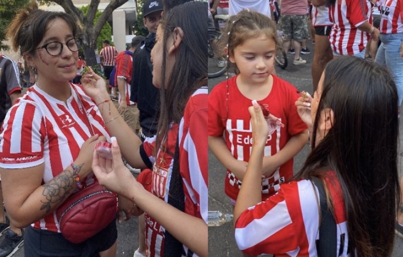 Una platense vende glitter, maquilla gratis en la puerta de la cancha y fue motivo de burlas: ”Estoy muy agradecida”